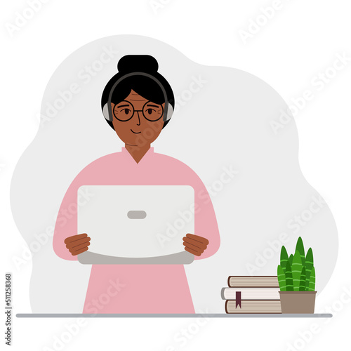 Woman with laptop and headphones. Working from home, student, freelancer, assistant, blogger or businessman. Home office concept.