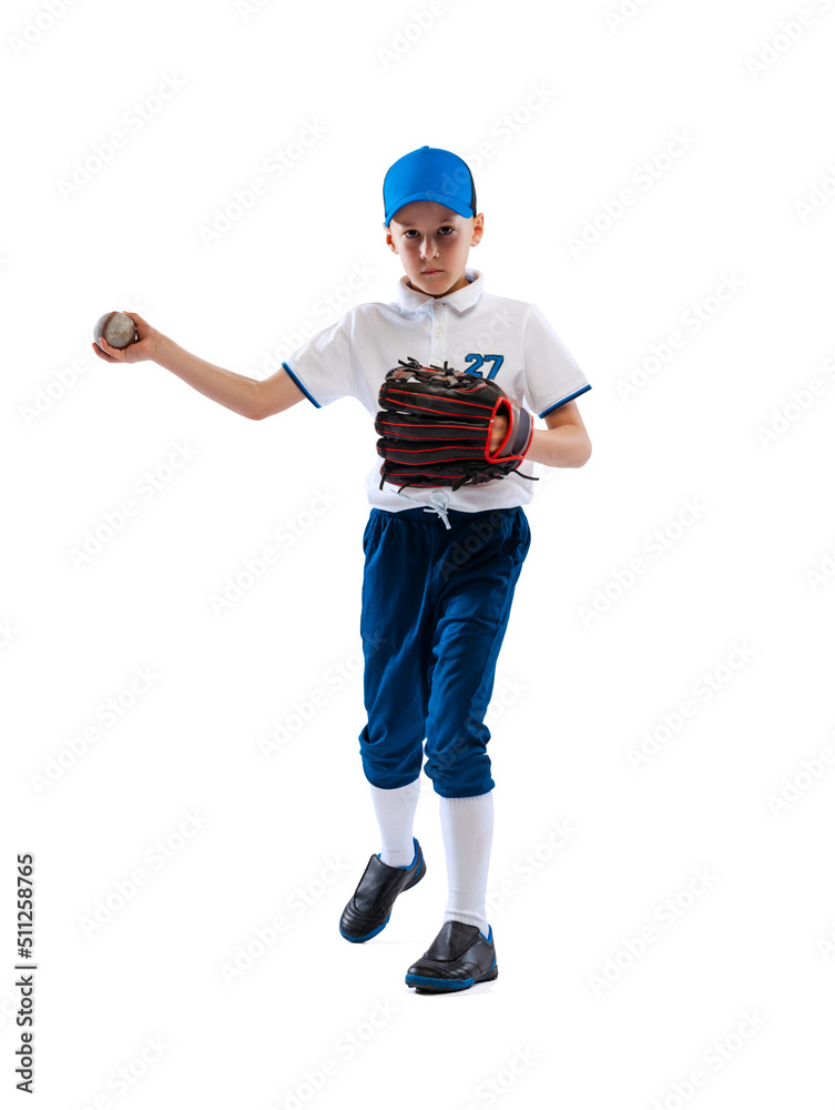 Little boy, baseball player, pitcher in blue-white uniform training isolated on white studio background. Concept of sport, achievements, studying, competition. Little boy, baseball player, pitcher in blue-white uniform training isolated on white studio background. Concept of sport, achievements, studying, competition.