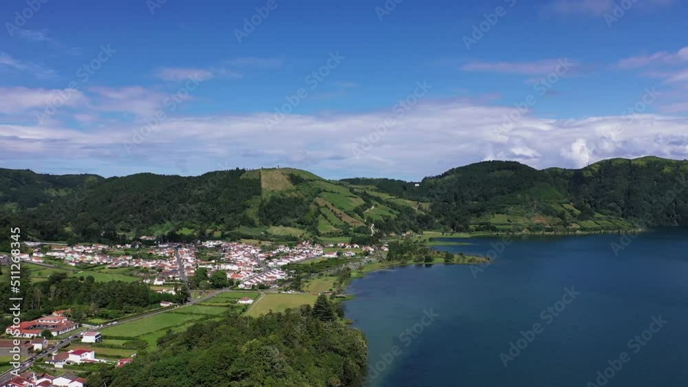 Azores. San Miguel. Aerial view. Aerial view of the Blue lake in west part of San Miguel island, Azores. High forest mountains around the lake. Eco tourism in Azores. Azores. San Miguel. Aerial view. Aerial view of the Blue lake in west part of San Miguel island, Azores. High forest mountains around the lake. Eco tourism in Azores.