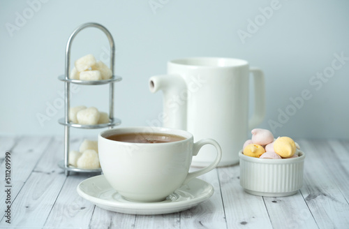 Green tea, Sweets, teapot, milk, on a white background