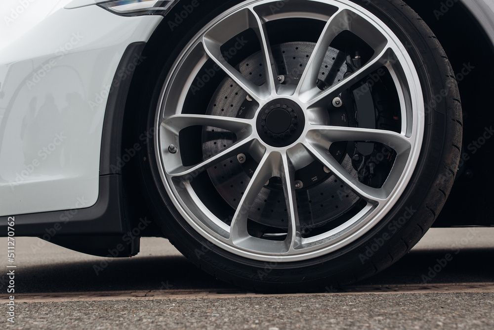 Close-up view on the wheel of sport car Close-up view on the wheel of sport car