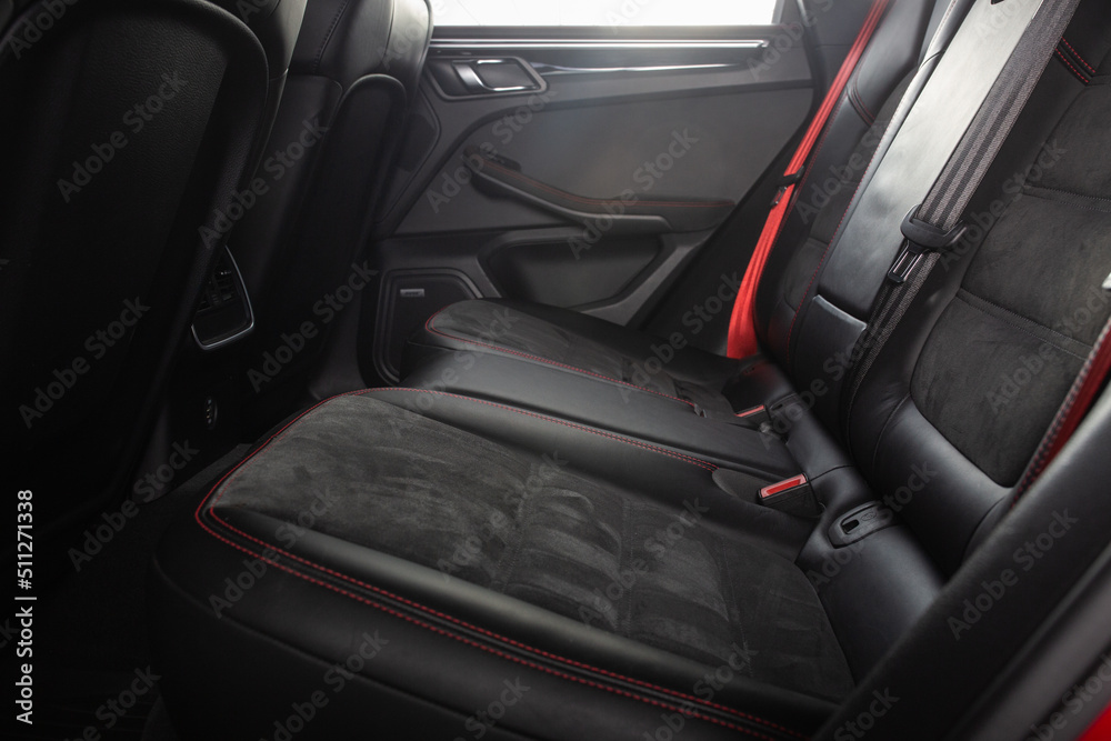 Luxury car rear seats row. Expensive car leather seats view from the front seats.