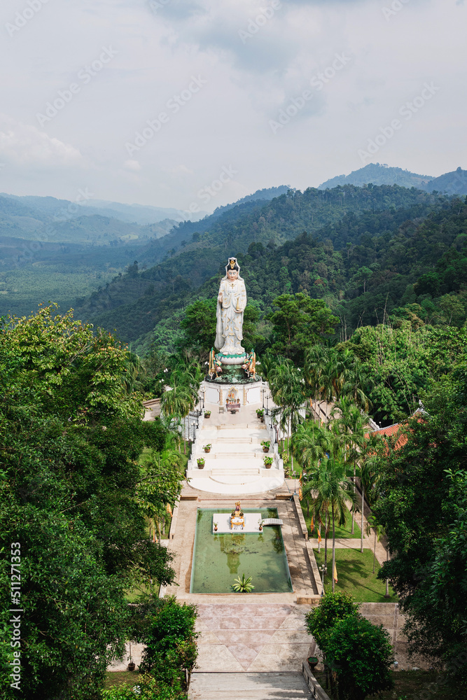 Scenic view on giant Guan Yin statue in the Wat Bang Riang temple in Phang-nga, Thailand. Scenic view on giant Guan Yin statue in the Wat Bang Riang temple in Phang-nga, Thailand.