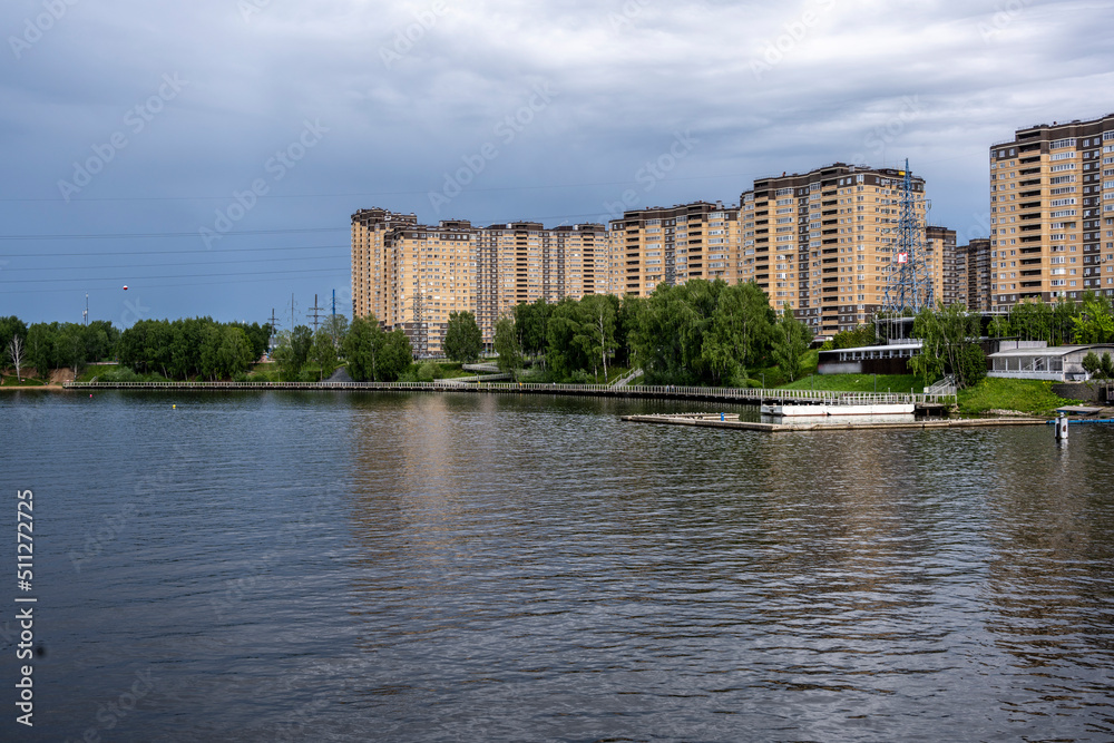 landscape with a view from the river boat to the coastline on a summer day