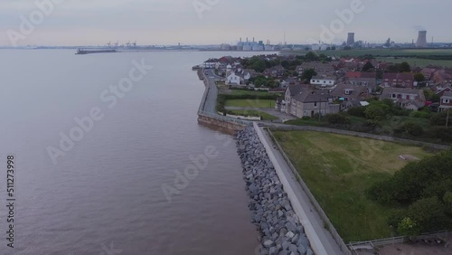 Wallpaper Mural Drone shot. Coastal flood defenses, English coastal village, houses, suburban. Filmed Yorkshire. England. Torontodigital.ca