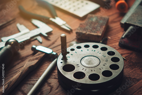 Desktop for craft jewellery making with professional tools. Vintage jeweler tools on wooden table. Jewelry craftsmanship