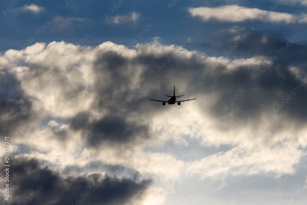 Airplane in the cloudy sky. Airplane in the cloudy sky.