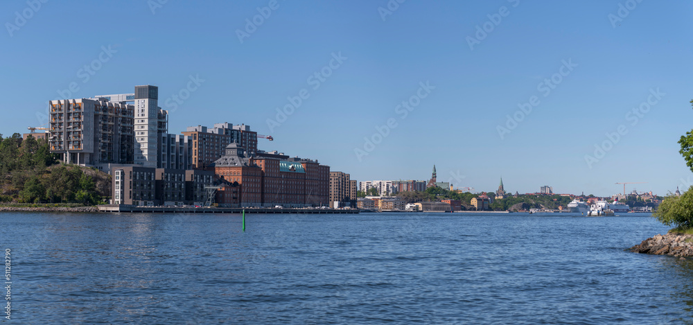 The apartment houses at the pier Kvarnholmen in the district Nacka a sunny summer day in Stockholm  