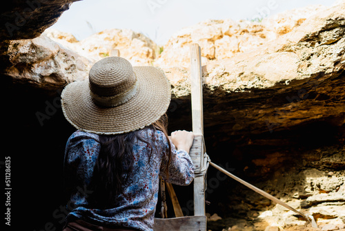 Hiker exploring a cave on vacation