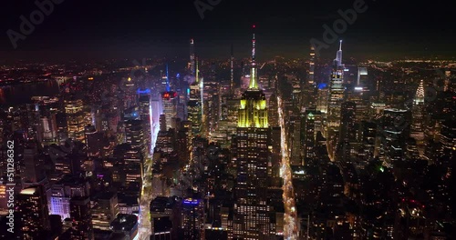 Twinkling lights at the top of The Empire State Building. Sparkling panorama of New York city at night.