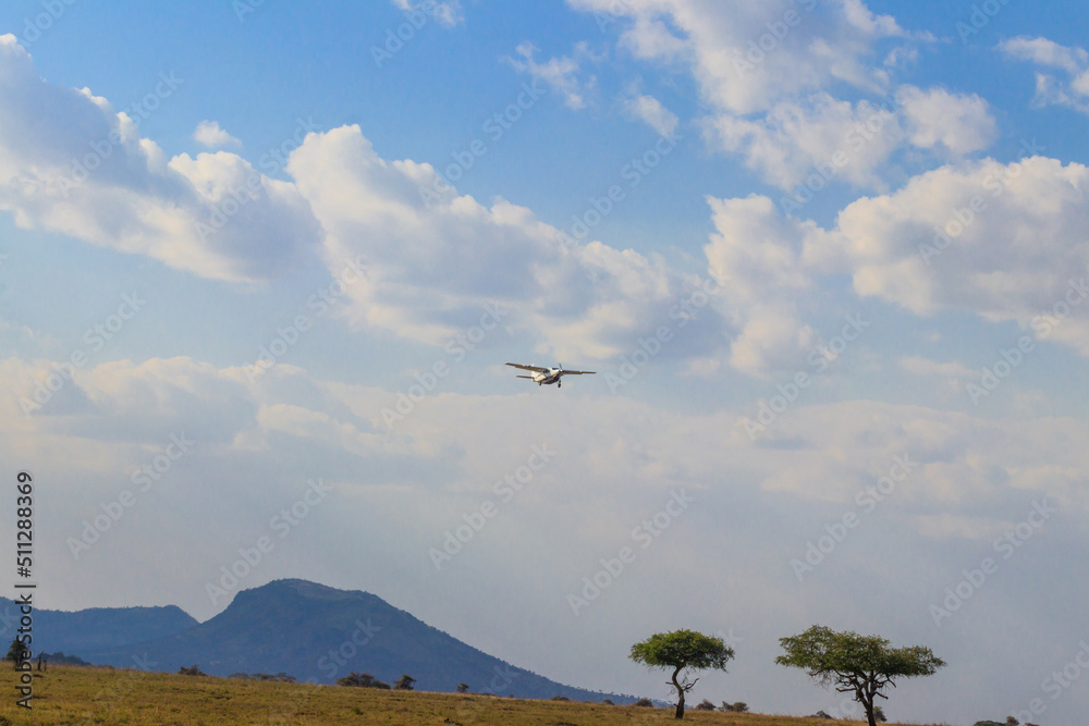 Airplane flying over the african savanna in Serengeti national park, Tanzania