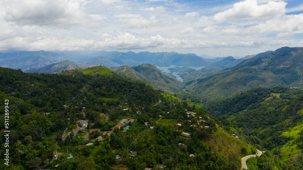 Top view of Mountain slopes with rainforest and a mountain valley with farmland. Sri Lanka.