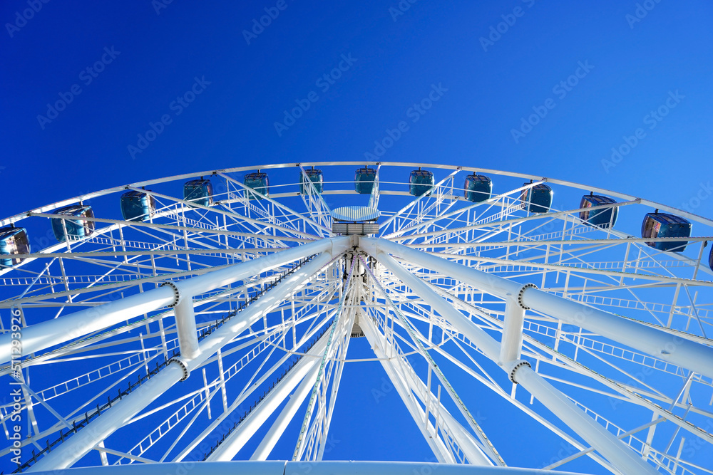 Ferris wheel against the blue clear sky, April, Estonia, Tallinn