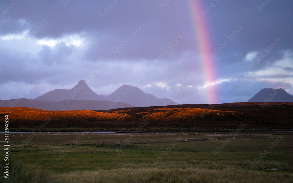 Rainbow over the Scottish Highlands, North Coast 500 Banner image.  Mountains and Scottish weather