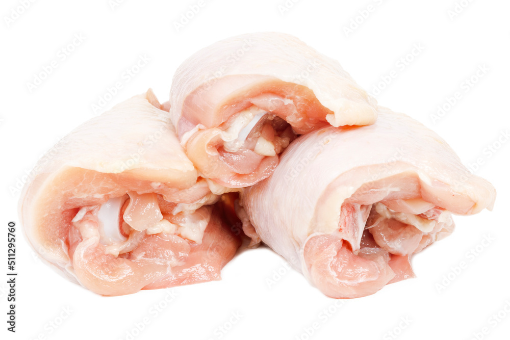 Raw chicken meat on a white background, broiler thigh. Raw chicken meat on a white background, broiler thigh.