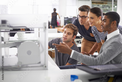 Last minute quality check. A shot of colleagues working together in the office.