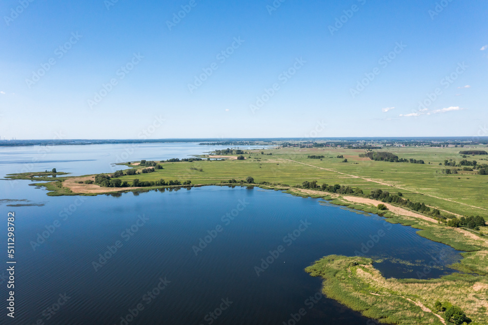 View from the drone over the lake and thickets, lake landscape.