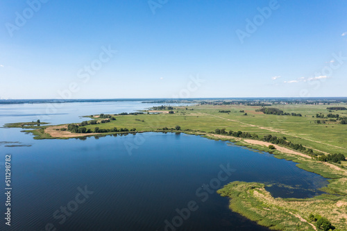 View from the drone over the lake and thickets, lake landscape.