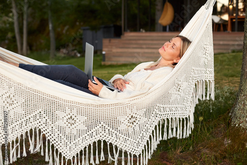 Woman relaxing on hammock photo