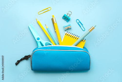Tela Top view of pencil case with school supplies