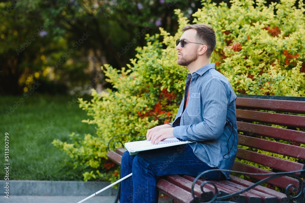 Fototapeta premium blind man sitting on a bench