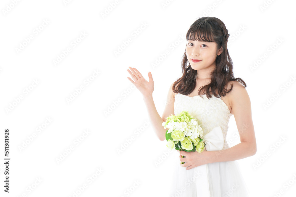 Young woman with bouquet pointing something Young woman with bouquet pointing something