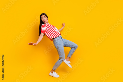 Fototapeta Naklejka Na Ścianę i Meble -  Full size of nice carefree person enjoy dancing spend free time weekend isolated on yellow color background