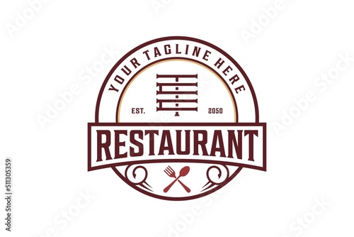 Vintage restaurant cafe logo design spoon and fork icon rounded shape