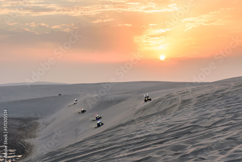 Fototapeta Naklejka Na Ścianę i Meble -  Sunset over Sealine sand dunes, Qatar, Middle East