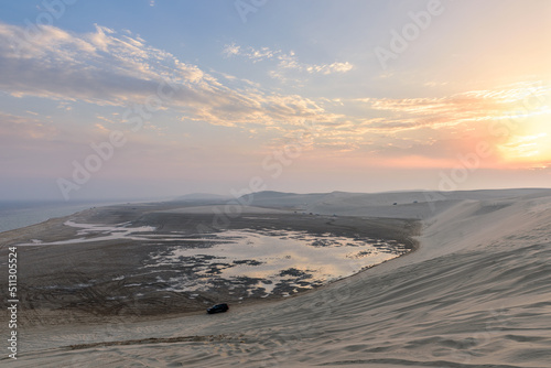Sunset over Sealine sand dunes, Qatar, Middle East photo