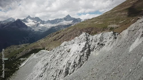 Swiss alps drone aerial view. rocky mountains and fields photo