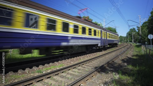 The train passes by in Jurmala on a sunny summer day. Model trains of the Soviet era. The train passes through the city and is popular with the residents of Riga in Latvia.