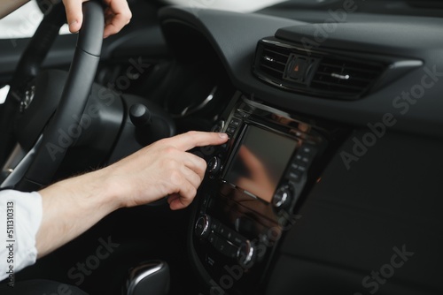 Modern car interior dashboard and steering wheel © Serhii