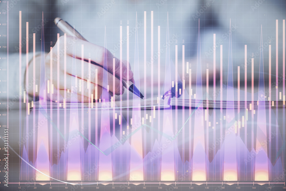Hands writing information about stock market in notepad. Forex chart holograms in front. Concept of research. Multi exposure Hands writing information about stock market in notepad. Forex chart holograms in front. Concept of research. Multi exposure