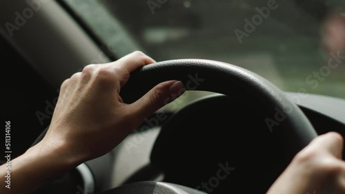 woman is driving an SUV on the highway in the summer