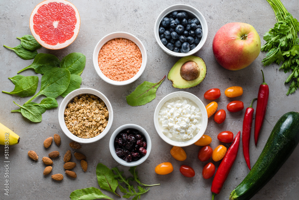 Healthy food: fruit, vegetable, superfood, leaf vegetable on gray concrete background