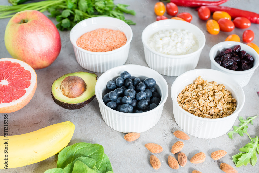 Healthy food: fruit, vegetable, superfood, leaf vegetable on gray concrete background Healthy food: fruit, vegetable, superfood, leaf vegetable on gray concrete background