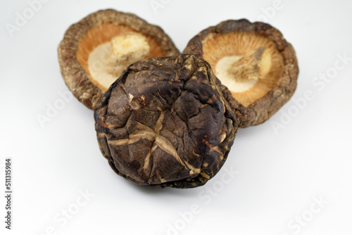 Dried shiitake mushrooms on a white background 