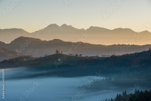 Saint Thomas church in Slovenia at sunrise photo