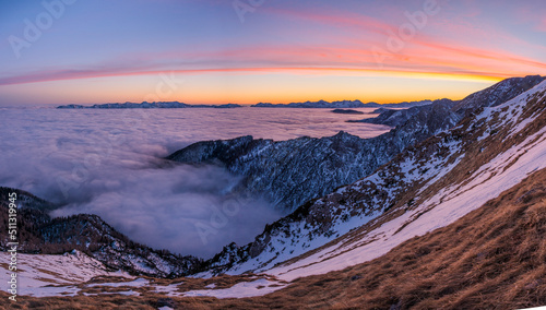Sunset in the mountains with fog in the valley