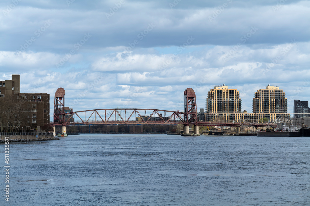 Fototapeta premium Steel Railroad Bridge with Rails over East River areal view . High - quality photo