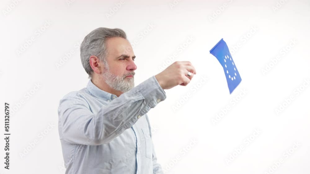 Senior European bearded man waves European Union flag studio shot copy space medium shot isolated white background . High quality 4k footage Senior European bearded man waves European Union flag studio shot copy space medium shot isolated white background . High quality 4k footage
