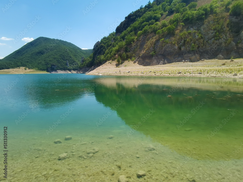 View of mountain lake with emerald water in Lazio