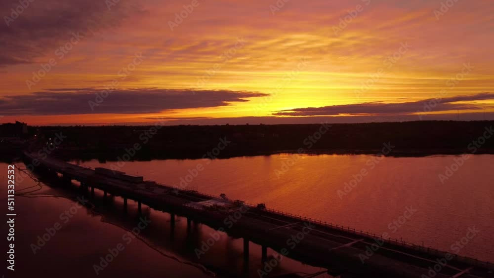Aerial sunset over bridge under construction Aerial sunset over bridge under construction