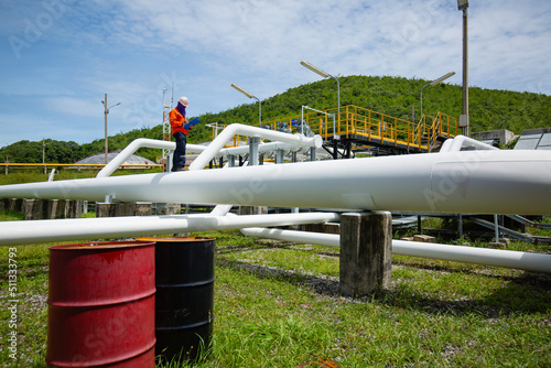 Fototapeta Naklejka Na Ścianę i Meble -  Male worker inspection at valve of visual check record pipeline oil and gas