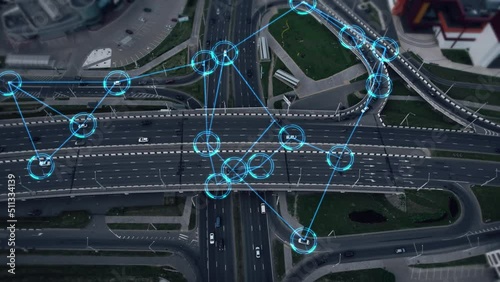 Concept of smart cars and transportation of the future. Automated robotic system remotely controls self-driving cars in the city. Artificial Intelligence Digitalizes and Analyzes Roads. Aerial view. 