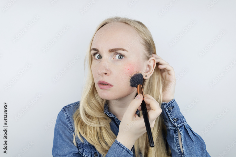 Allergy to cosmetics. Girl got acne from a poor-quality cream, powder or foundation. Concept of skin reaction to substandard or toxic products. Allergy to cosmetics. Girl got acne from a poor-quality cream, powder or foundation. Concept of skin reaction to substandard or toxic products.
