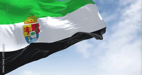 The Extremadura flag waving in the wind on a clear day photo