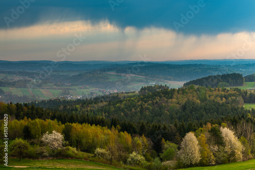 Dark Clouds over Green Lush Rolling Hills in Polish Countryside © marcin jucha