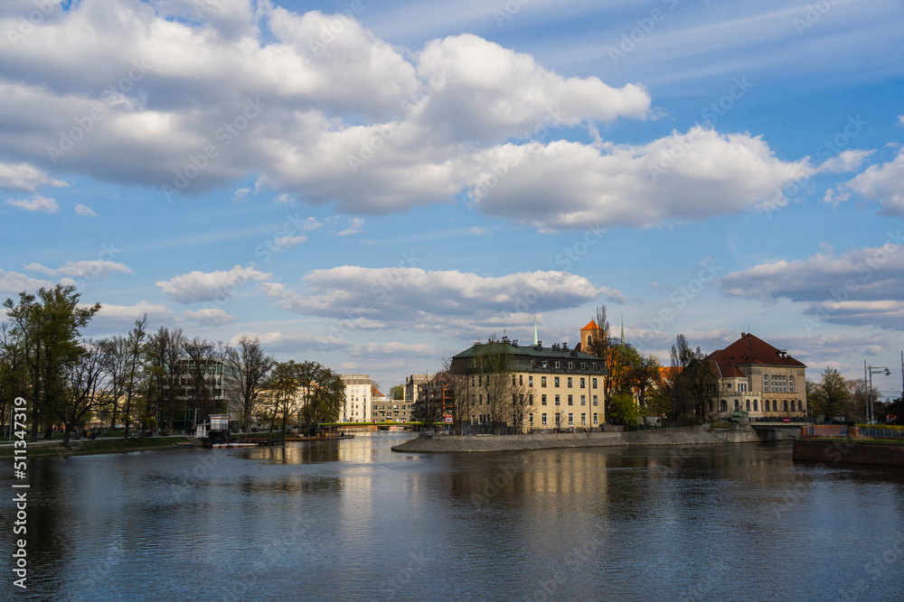 Buildings and river with sky at background in Wroclaw